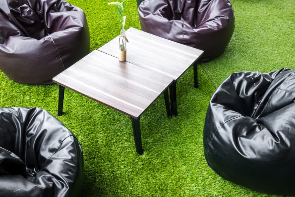 Tables and chairs in restaurant .